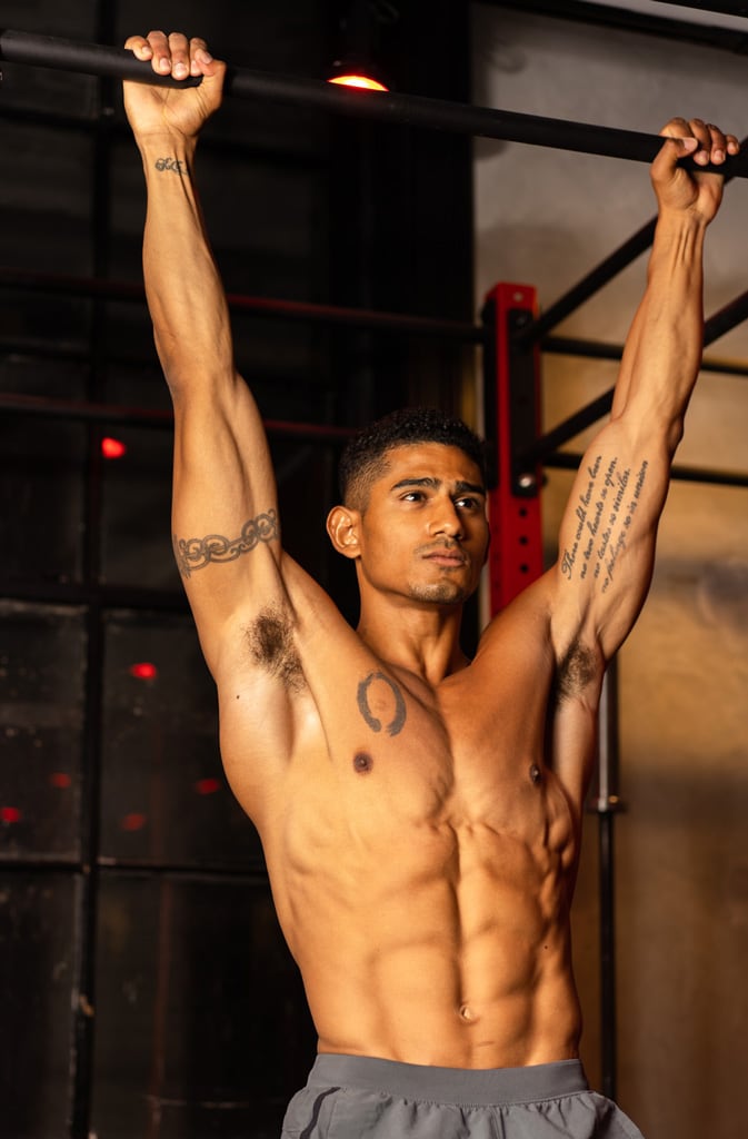 Coach is doing pull ups.